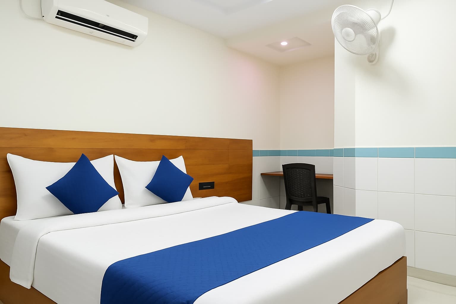 Deluxe AC Room — air conditioning, work desk and double bed